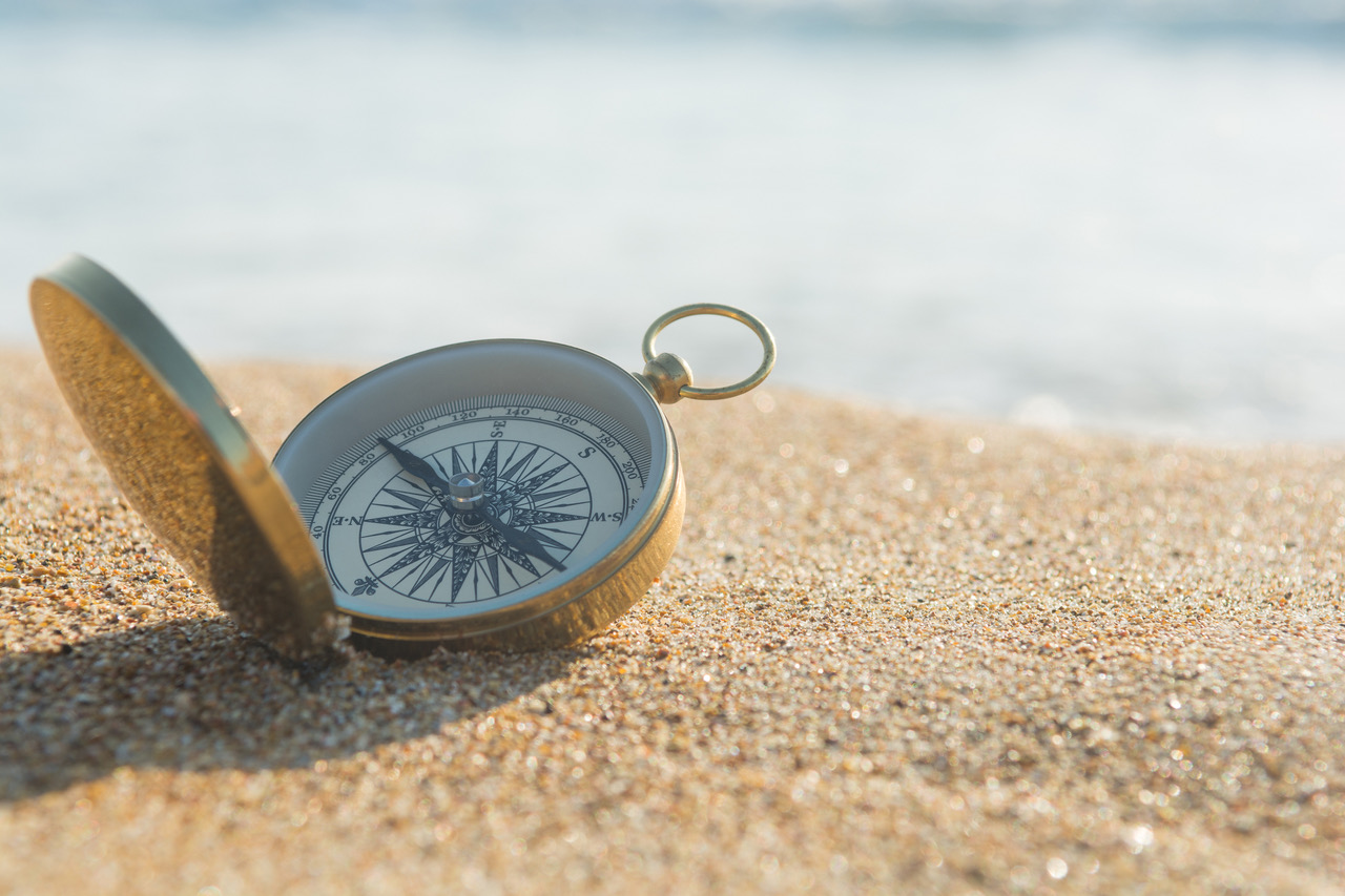 compass on beach