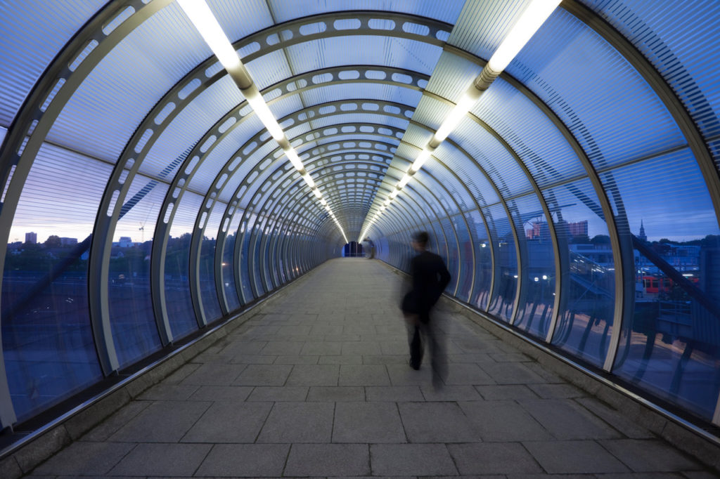 professional crosses bridge